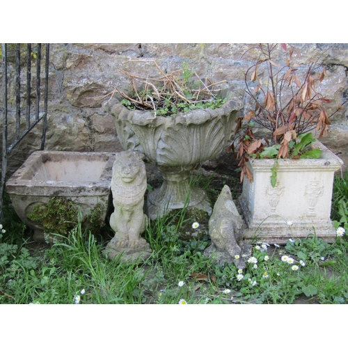 723 - A weathered cast composition stone garden urn with circular acanthus leaf bowl, raised on a loose so... 