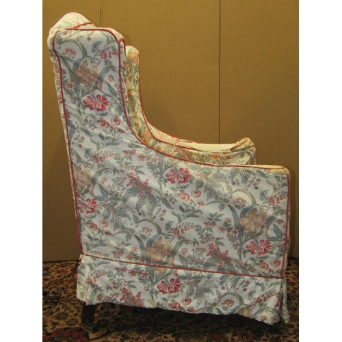 3612 - A 19th century wing chair with shaped arms and cabriole forelegs