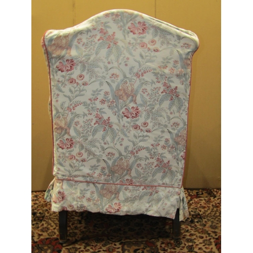 3612 - A 19th century wing chair with shaped arms and cabriole forelegs