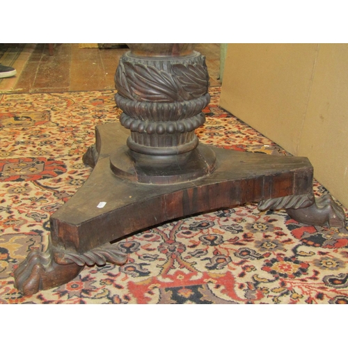 3624 - An Indian Colonial hardwood centre table on platform base, turned and carved column supporting circu... 