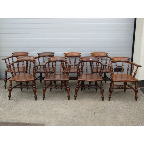 3637 - A perfectly matched set of eight 19th century Windsor smokers bow elbow chairs, in elm and beech, wi... 