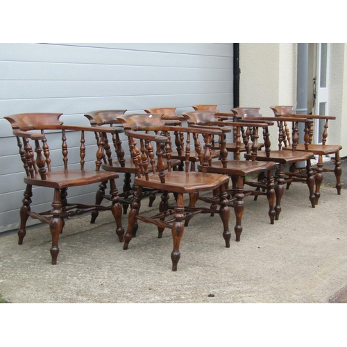 3637 - A perfectly matched set of eight 19th century Windsor smokers bow elbow chairs, in elm and beech, wi... 