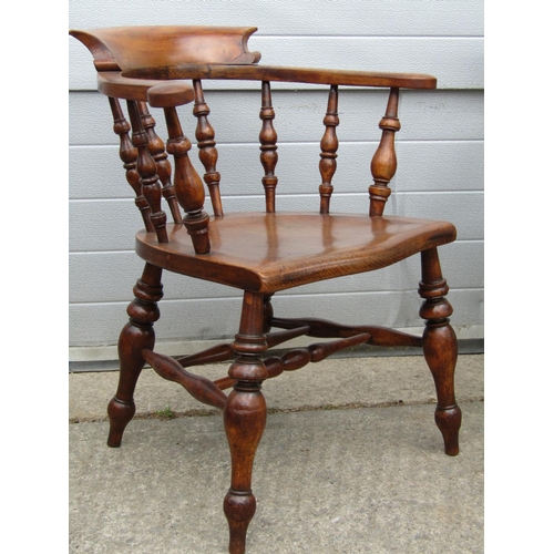 3637 - A perfectly matched set of eight 19th century Windsor smokers bow elbow chairs, in elm and beech, wi... 