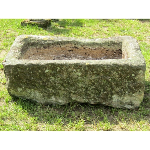 697 - A weathered rectangular carved natural stone trough with drainage hole 76cm long x 46cm wide x 29cm ... 