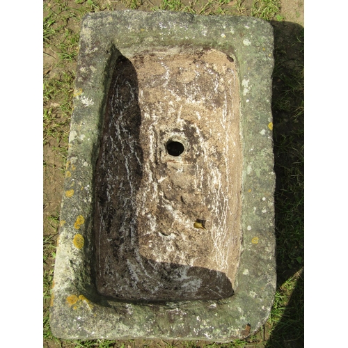 697 - A weathered rectangular carved natural stone trough with drainage hole 76cm long x 46cm wide x 29cm ... 