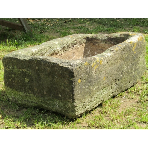 697 - A weathered rectangular carved natural stone trough with drainage hole 76cm long x 46cm wide x 29cm ... 