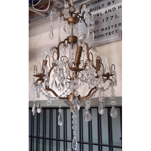 3033 - A six branch chandelier with pear cut floral and other glass droplets, 80cm high approx