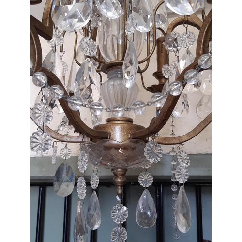 3033 - A six branch chandelier with pear cut floral and other glass droplets, 80cm high approx
