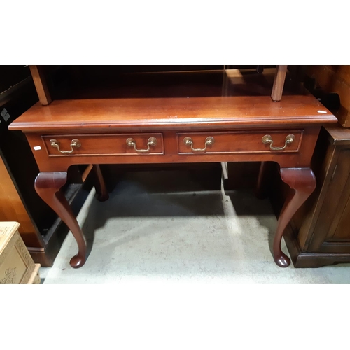 3115 - A mahogany side table, two frieze drawers on four pad feet, 105 cm