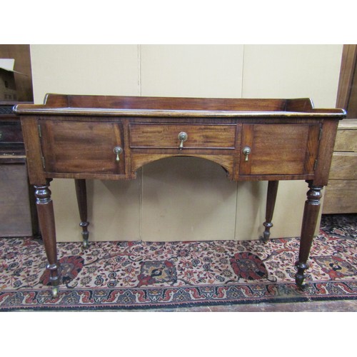 3632 - 19th century mahogany side table with three quarter gallery with two cupboards and central drawer ov... 