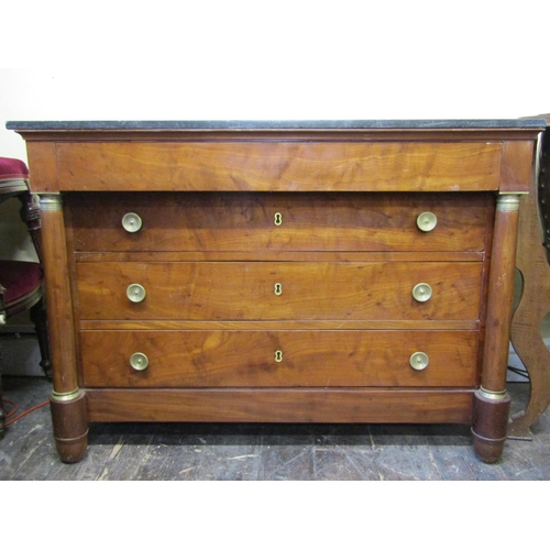 3631 - Early 19th century French Empire period walnut commode of four drawers with turned column supports, ... 