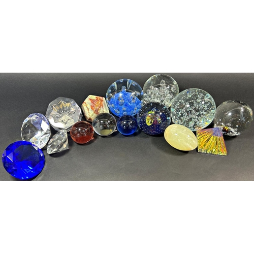 1121 - Approximately 60 glass paperweights of various shapes and designs, varying from clear bubble to flor... 