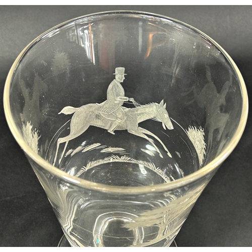 1125 - A large glass or vase with an engraved huntsman on horseback with fox hounds, on a rounded foot, 24.... 