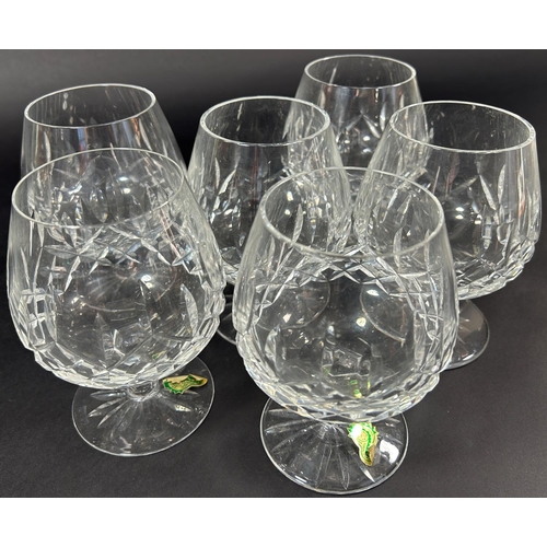 1126 - An Edwardian style cut glass decanter with six matching brandy goblets, and salt and pepper pots wit... 