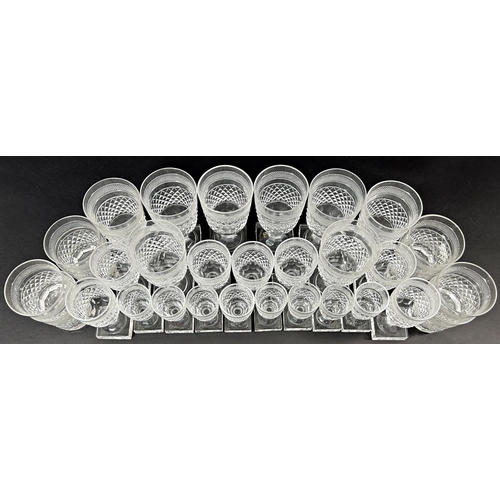 1128 - A suite of early 20th century square cut glass ware, consisting of eight wine glasses, eight tumbler... 