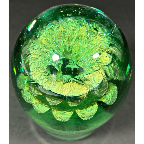 1149 - A Victorian green glass dump, with a silver potted plant internal decoration, 11cm high.