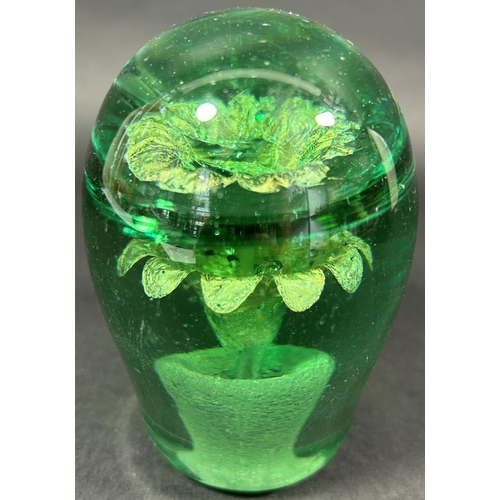 1149 - A Victorian green glass dump, with a silver potted plant internal decoration, 11cm high.