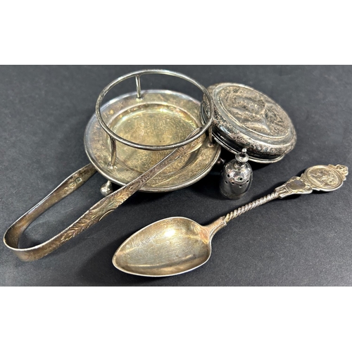 1207 - A richly engraved silver cigarette case, a curved cigarette case, sugar tong, teaspoon, two silver c... 