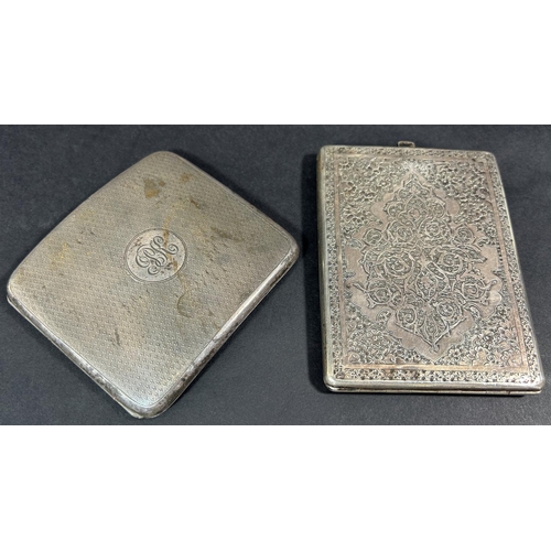 1207 - A richly engraved silver cigarette case, a curved cigarette case, sugar tong, teaspoon, two silver c... 