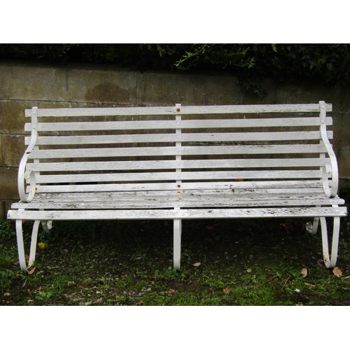 2070 - A vintage sprung steel garden bench with wooden lathes and painted finish, 185 cm long