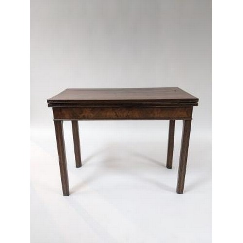 2738 - A George III mahogany card table, the fold over top with blind fret carved edge and on square moulde... 