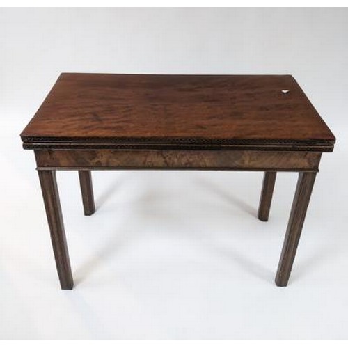 2738 - A George III mahogany card table, the fold over top with blind fret carved edge and on square moulde... 