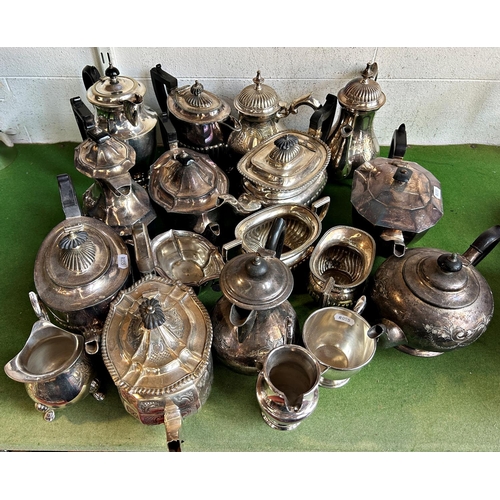 1165 - A mixed selection of silver plated teapots, coffee pots of various styles together with some matchin... 