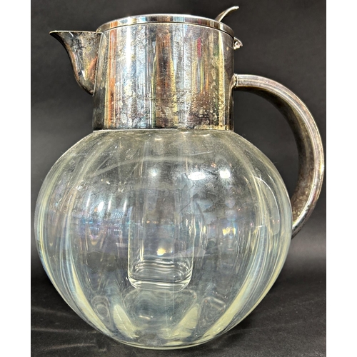 1179 - A faintly gourd shaped silver plated mounted glass water jug with an inner, removable,  ice cooler a... 