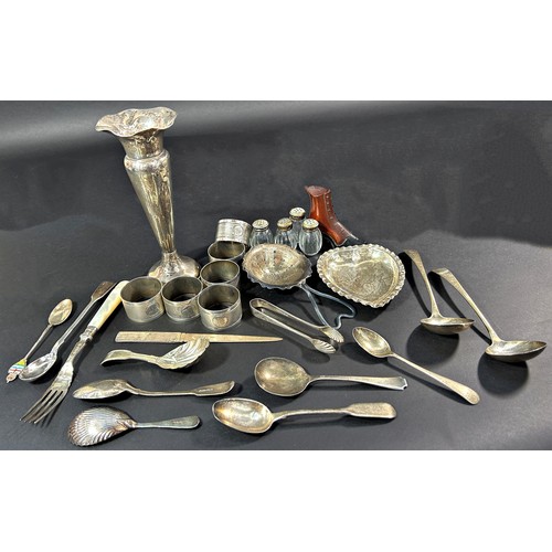A mixed selection of silver including six napkin rings, a posy vase, tea strainer, paper knife, two scalloped caddy spoons, sugar tong and eight various spoons and a heart shaped dish, some silver plated spoons, Christofle pepper pots, 13.8 ozs approximately excluding the weighted vase