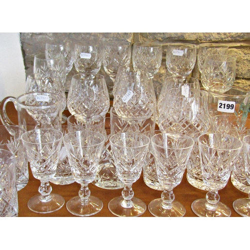 1143 - A collection of matching drinking glasses, eight wine glasses, six brandy, two tankards, six sherry,... 