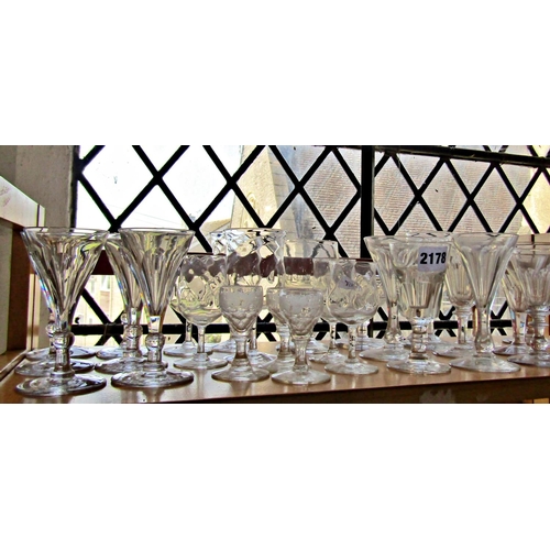 1129 - A good selection of 18th and 19th century glassware, including six matching wine glasses, several st... 