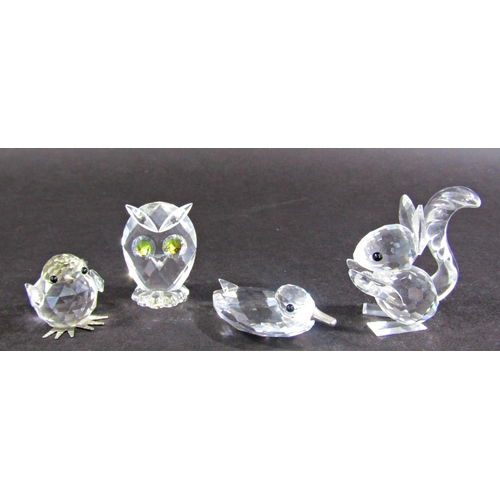 1132 - A collection of seven Swarovski crystal animals, marked to the base, and other glass animals along w... 