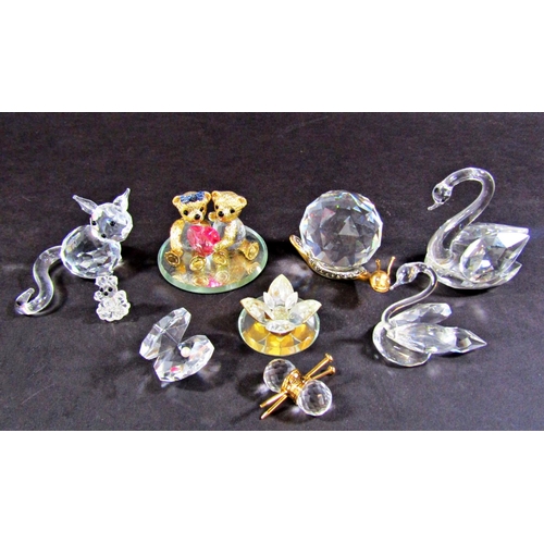 1132 - A collection of seven Swarovski crystal animals, marked to the base, and other glass animals along w... 