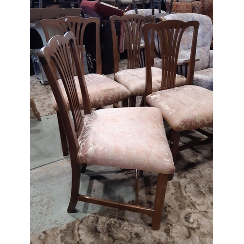 2169 - A set of four 19th century mahogany comb back dining chairs, with stuff over seats