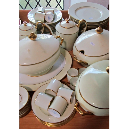 1004 - A collection of gilt edged Legle Limoges porcelain coffee and dinner wares comprising three lidded t... 