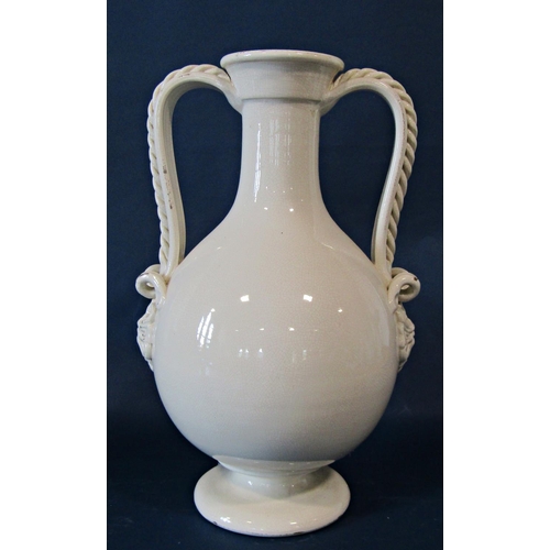 1010 - Two creamware crackle glazed large vases with drawn necks, decorated in relief with scrolling handle... 