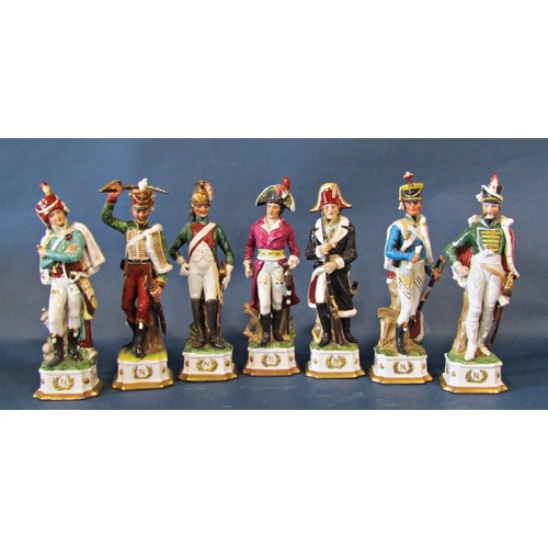 1011 - A collection of fourteen Napoleonic figures in military costume, 30cm tall approx