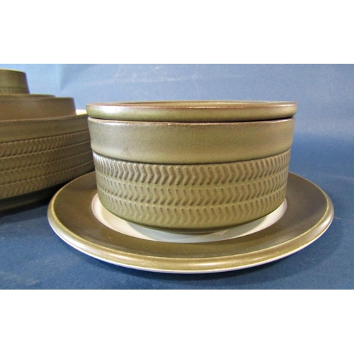 1014 - A collection of Denby table wares with olive green glaze and impressed chevron decoration to include... 