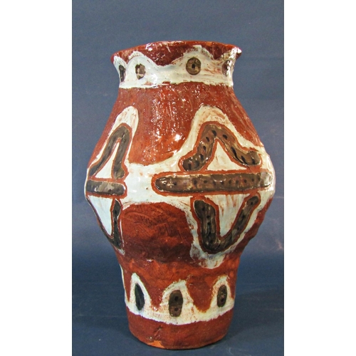 1021 - A large studio pottery vase with all over terracotta and olive abstract decoration, 36cm high approx... 