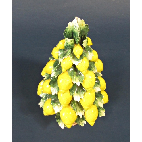 1027 - Ceramic Italian Capodimonte table centre - a bowl supporting a tower of lemons, 28cm tall