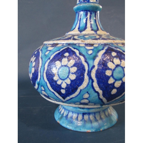 1031 - A North African vase with long drawn neck (af broken top) with all over turquoise and deep blue repe... 