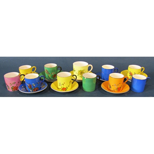 1032 - A collection of Crown Ducal decorative cabinet coffee cans and saucers in various bright colours wit... 