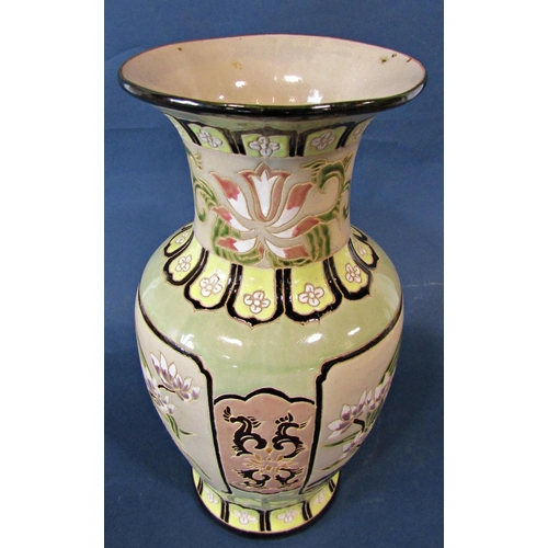 1034 - A large pottery vase decorated in an oriental style with incised lotus blossom detail, 51cm tall app... 