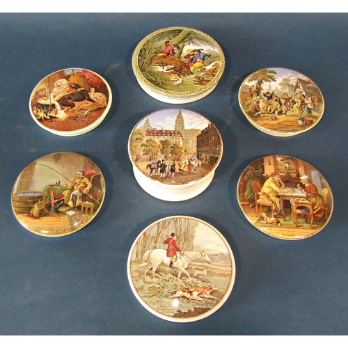 1035 - A collection of Pratt ware ceramic pot lids, each depicting a different scene, some with wooden moun... 