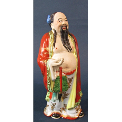 1040 - Two hand-painted porcelain Chinoiserie figures of men in traditional dress, one holding cymbals, tal... 