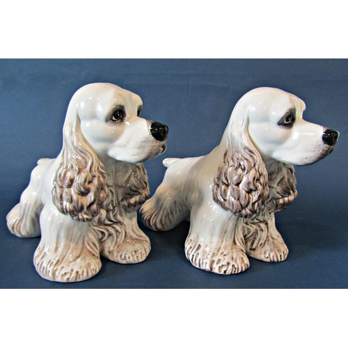 1055 - A pair of ceramic Cocker Spaniels, 25cm tall x 36cm long