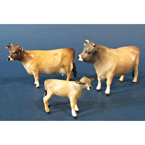 1057 - Two family groups of Beswick cattle comprising Jersey male, female and calf and Friesian male, femal... 