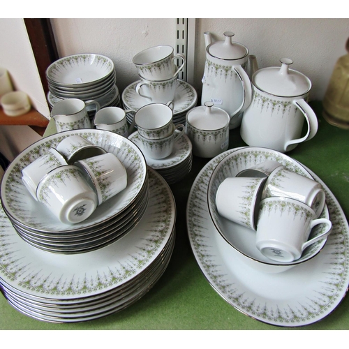 1072 - A Noritake dinner, tea and coffee service repeating geometric detail in a green colourway