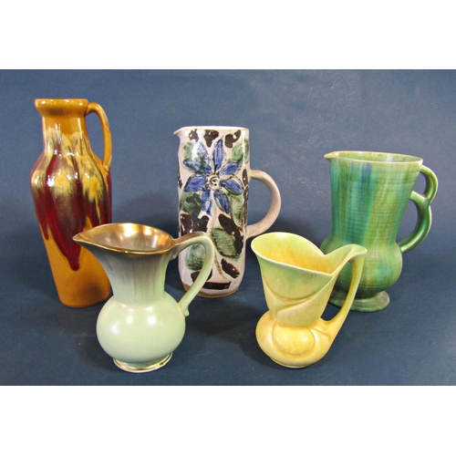 1076 - A collection of 1950s pottery jugs and vases, together with a number of figures, etc