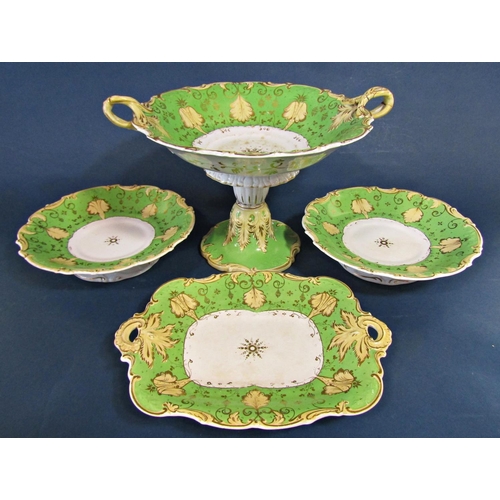 1079 - A collection of mid 19th century dessert ware in a green and gilt colourway, large stemmed comport, ... 